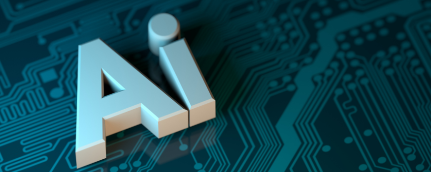 Das Wort AI fuer Artificial Intelligence auf einem Platinen Hintergrund