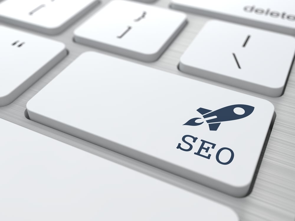 SEO button with rocket on modern keyboard